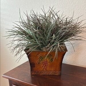 Rustic metal planter with faux greenery